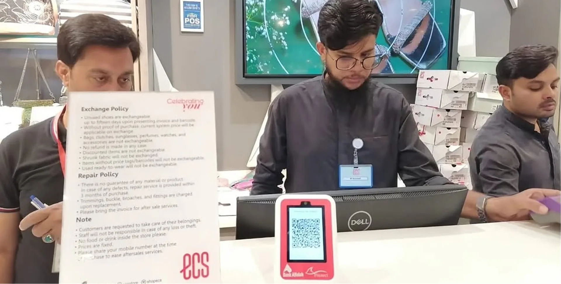 Bank Alfalah Finnect QR payment device at a store checkout counter with an FBR POS sign
